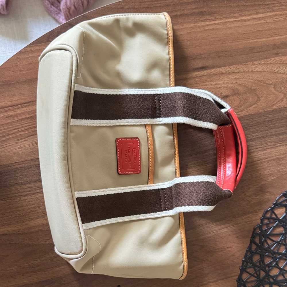 Coach Beige and Brown Leatherware with dark orange patch and accents mini bag.